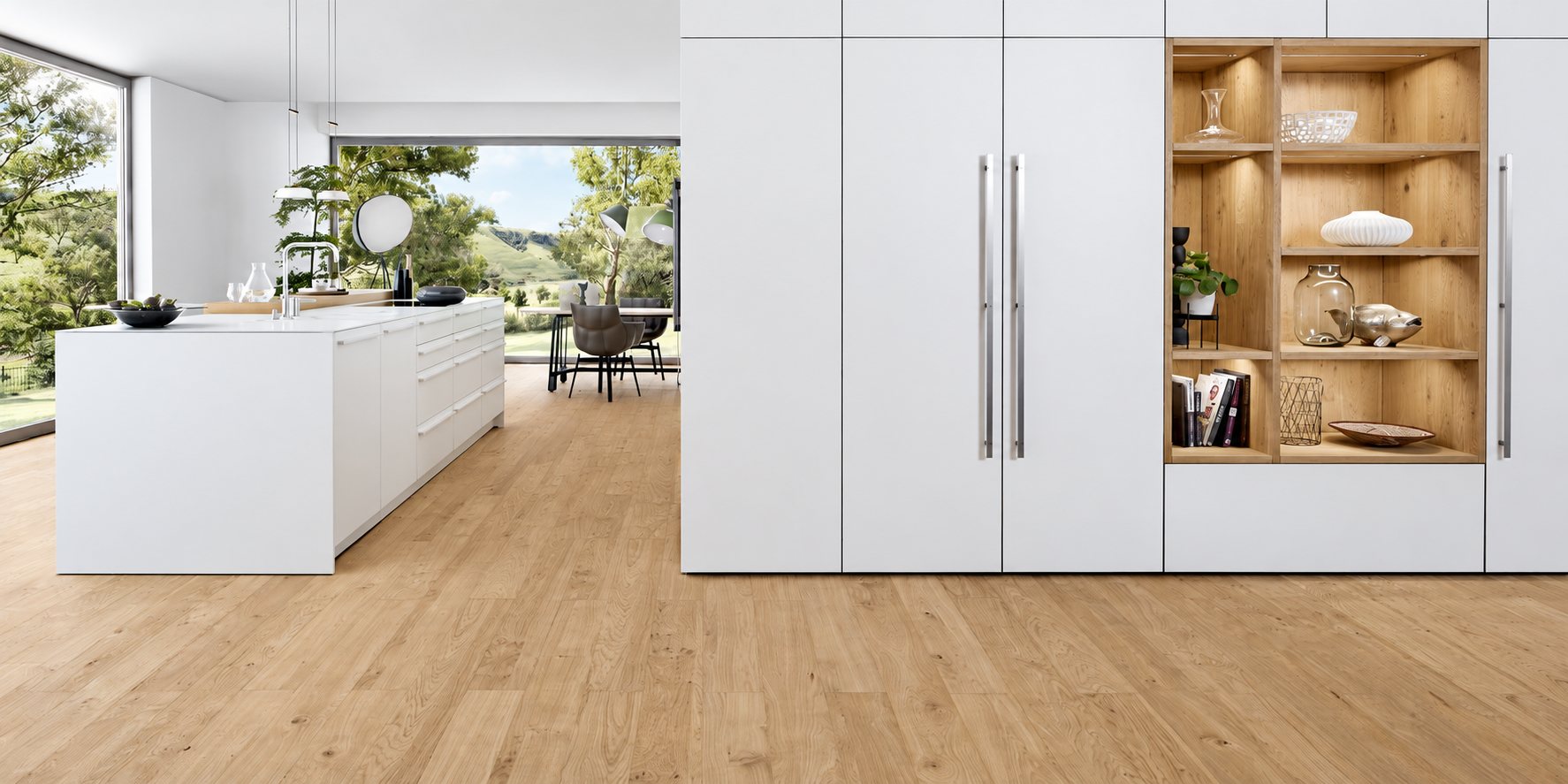 Une cuisine contemporaine aux façades blanches avec un grand îlot, une niche en bois et un parquet clair, ouverte sur un paysage verdoyant.